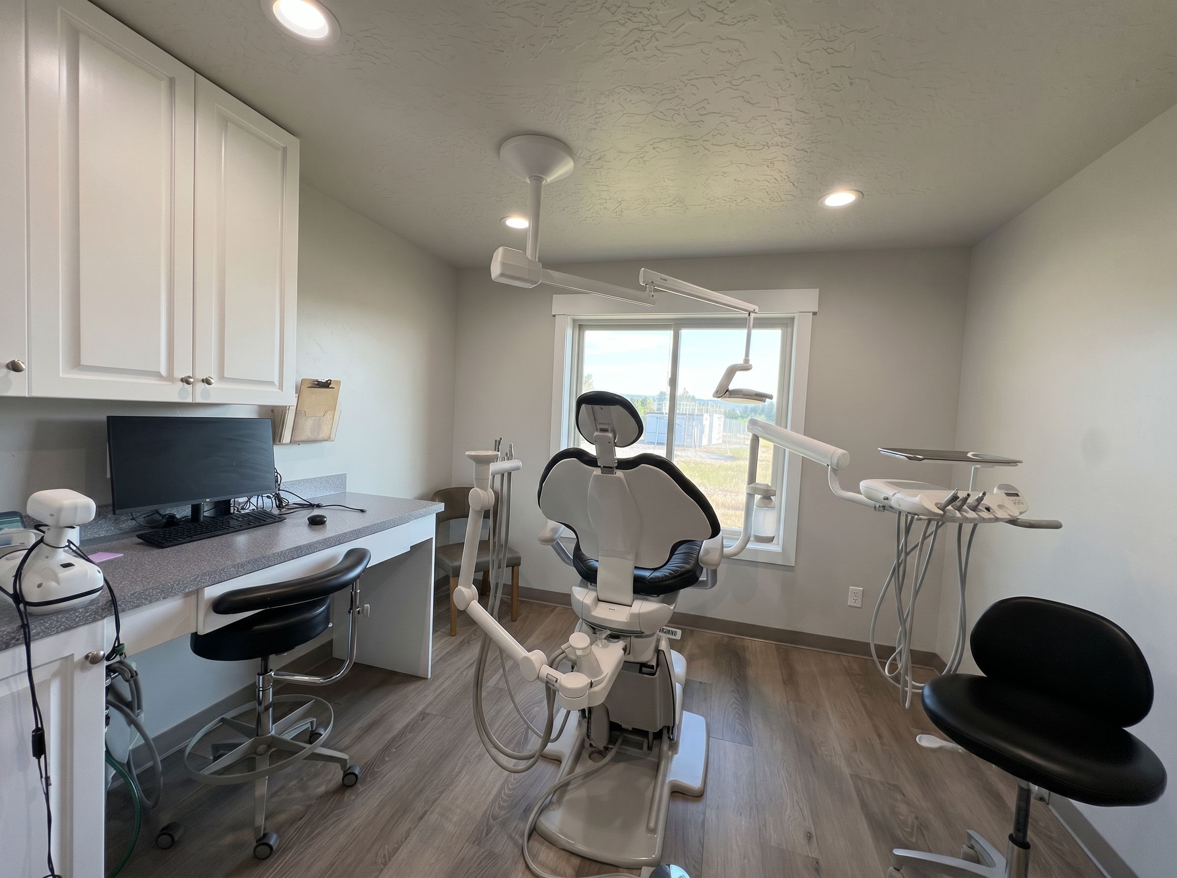 A patient room at Ashley Valley Family Dental with a window view